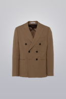 Double breasted blazer in tan made from TR poly viscose fabric. Features peak lapel, six buttons, and pipped pockets. Unconstructed for comfort.