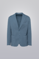 Garment dyed blazer in light blue made from cotton stretch fabric. Single-breasted with patch pockets and peak lapel, unconstructed for comfort.