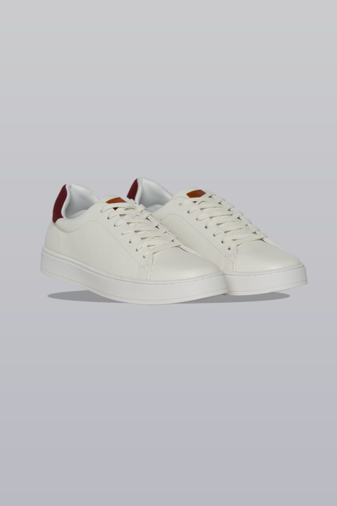 White and red sneakers with true-to-size fit.