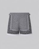 Black silk swim short for men featuring an all-over geometric print, adjustable side straps, button and zipper closure, metal hardware, zippered back pockets, and mesh lining by Clubman by Leonardo.