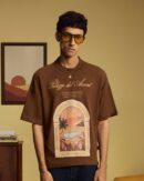 Brown Palazzo Shirt in premium 240 GSM cotton featuring exclusive Lost My Accent graphic artwork, a relaxed unisex fit, and a ribbed crew neck.