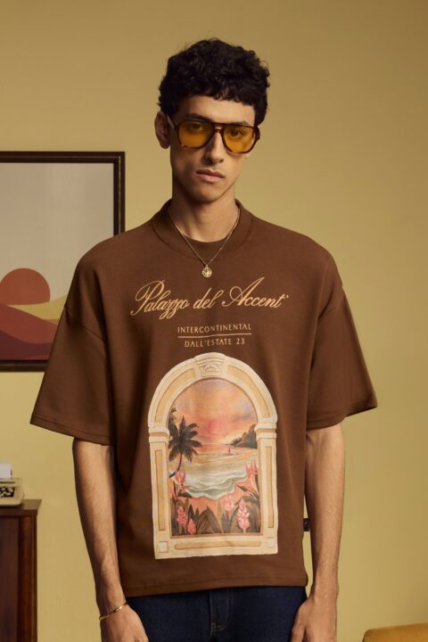 Brown Palazzo Shirt in premium 240 GSM cotton featuring exclusive Lost My Accent graphic artwork, a relaxed unisex fit, and a ribbed crew neck.