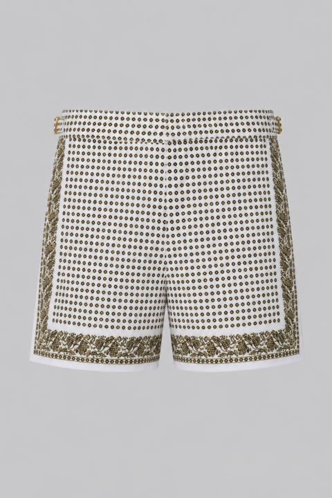 Green silk swim short for men featuring an all-over geometric print, adjustable side straps, button and zipper closure, metal hardware, zippered back pockets, and mesh lining by Clubman by Leonardo.