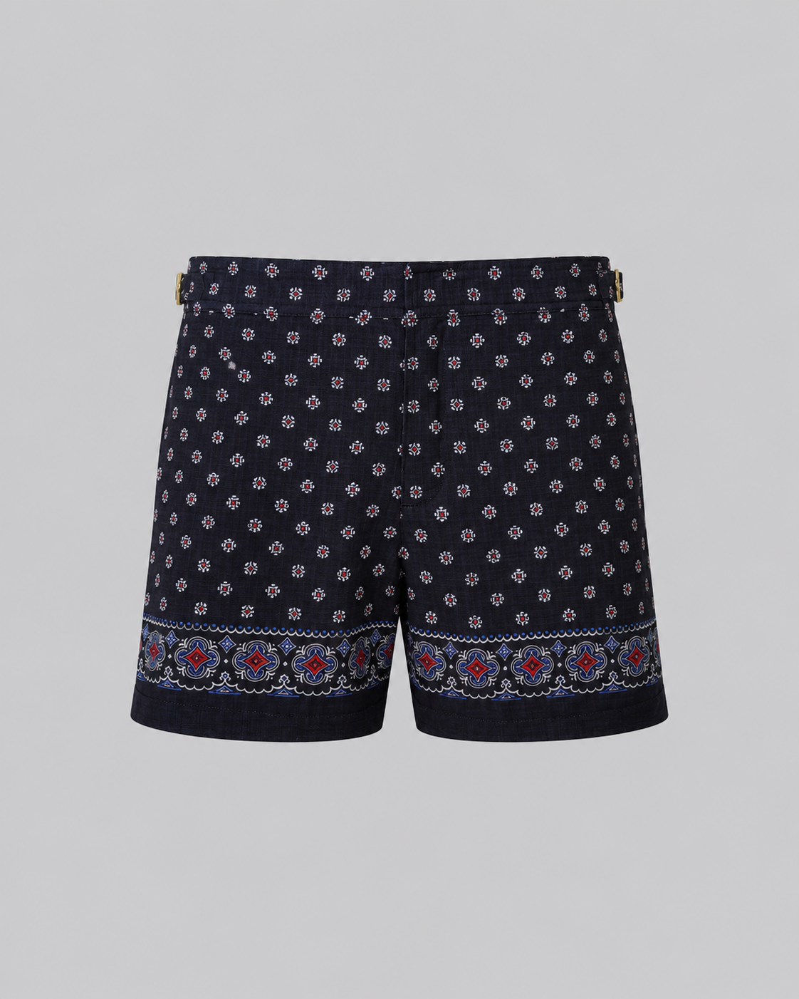 Silk Swim Short Navy silk swim short for men featuring an all-over geometric print, adjustable side straps, button and zipper closure, metal hardware, zippered back pockets, and mesh lining by Clubman by Leonardo.