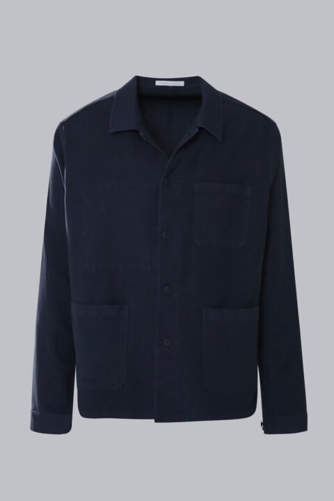 Men's Cotton Utility Jacket in navy with a button-front closure, classic collar, three functional patch pockets, and 100% cotton fabric.